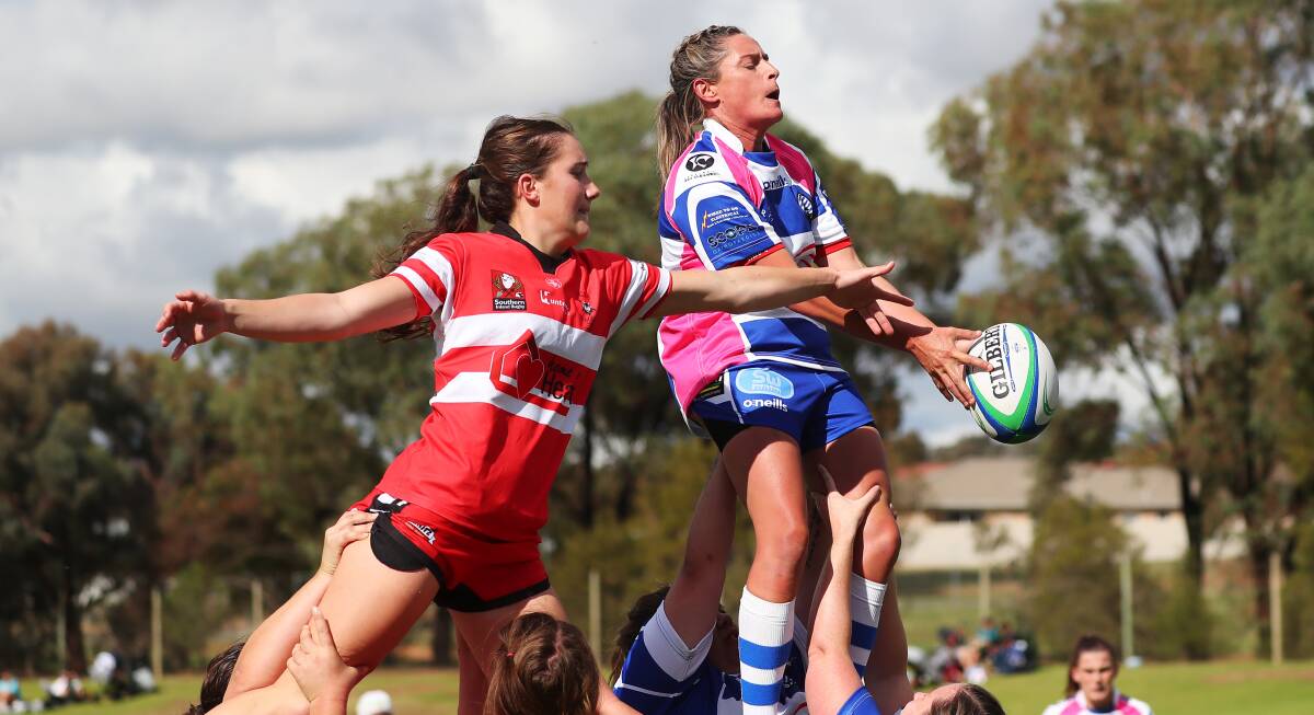 HOT STREAK: Ellen McIntyre, pictured trying to win a line-out off Apryll Green, scored six tries in CSU's win over Wagga City on Saturday. Picture: Emma Hillier