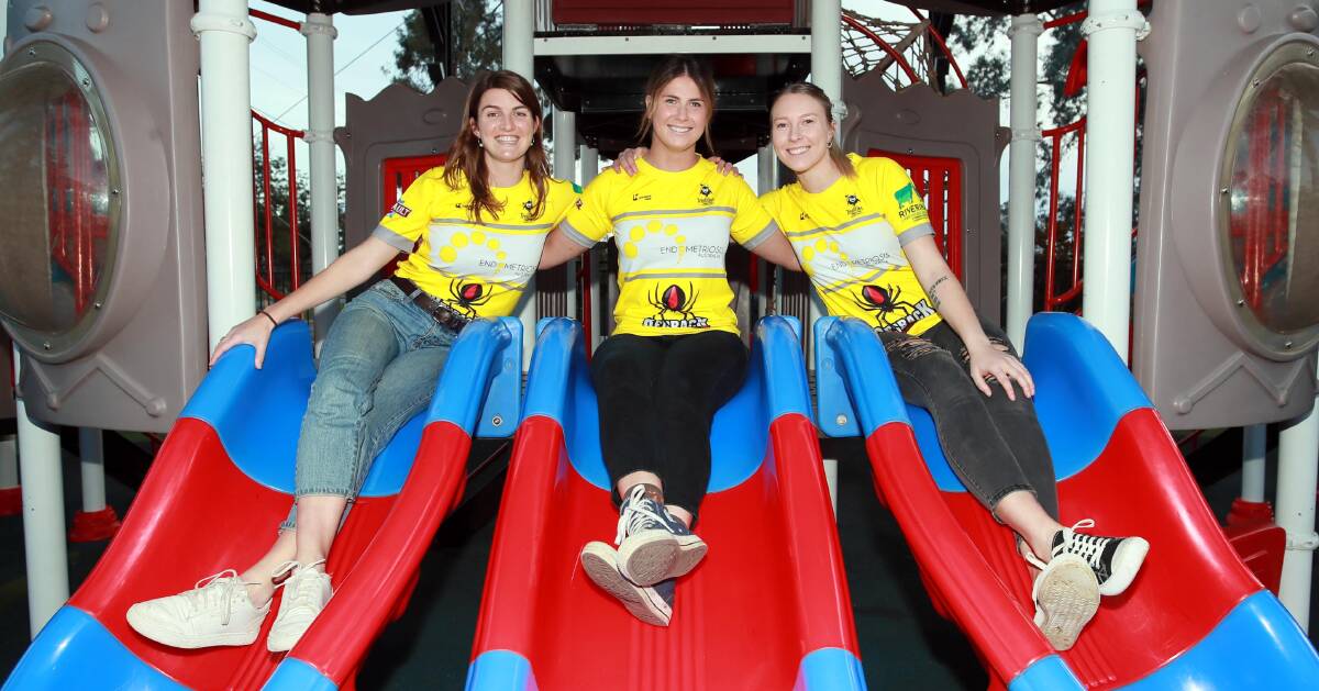 SPECIAL COLOURS: Lily Hogan, Ivy Merlehan and Georgia Roberts show off CSU's new jumpers for their ladies day on Saturday in support of endometriosis. Picture: Les Smith