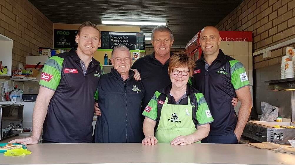 Joel Monaghan and Adrian Purtell do their part during canteen duty for Albury earlier this season.
