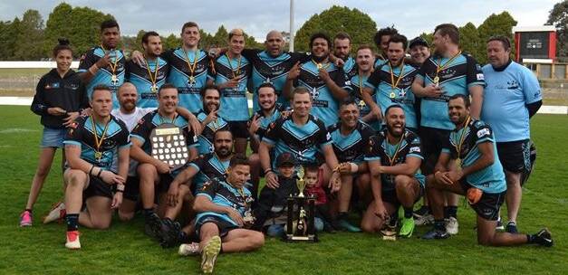 WINNERS ARE GRINNERS: Dindima celebrates after their win in the Queanbeyan/Canberra Community Rugby League Knockout on Saturday.