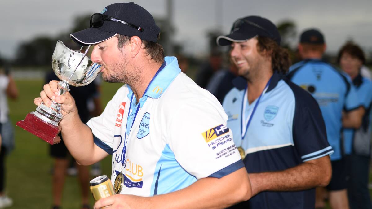 BENEFITS OF SUCCESS: Mitch Sykes takes a drink from the premiership cup after South Wagga ended their run of outs in Wagga Cricket grand finals.