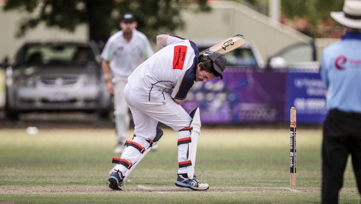 DUCKING FOR COVER: Mick Foster dodges a bouncer as Ardlethan-Barellan was bowled out for 52 in the O'Farrell Cup on Sunday. Picture: The Border Mail