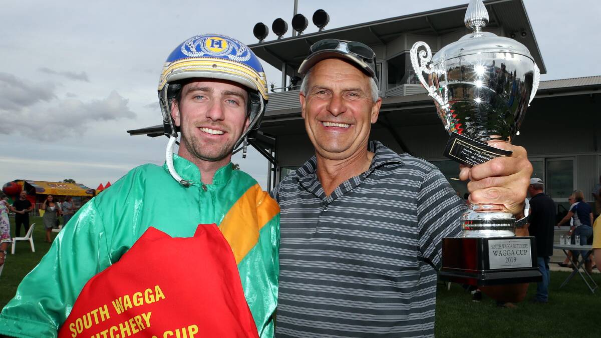 Former Junee reinsman Cameron Hart celebrates winning last year's Wagga Pacers Cup with Peter Trevor-Jones.