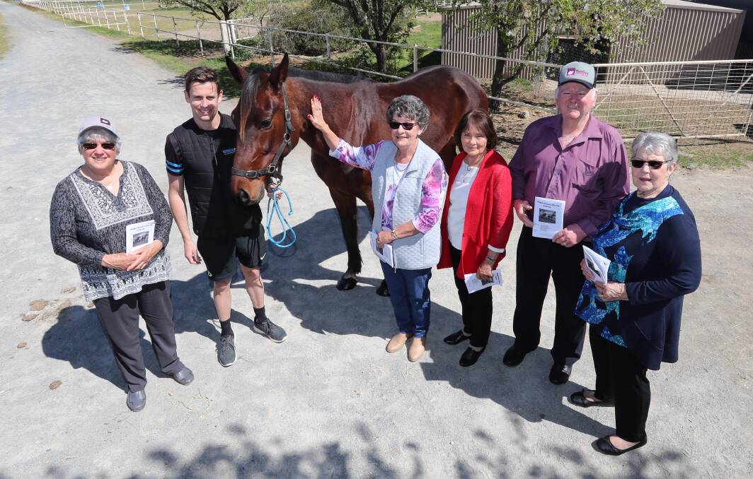 OWNERSHIP CHANCE: Settlers Village residents Marie Jennar, Marilyn Hillier, Bet Boscott, Col Cheney and Lyn May will be cheering on Arctic, pictured with Jared Kahlefeldt, in a special race on Saturday. Picture: Les Smith