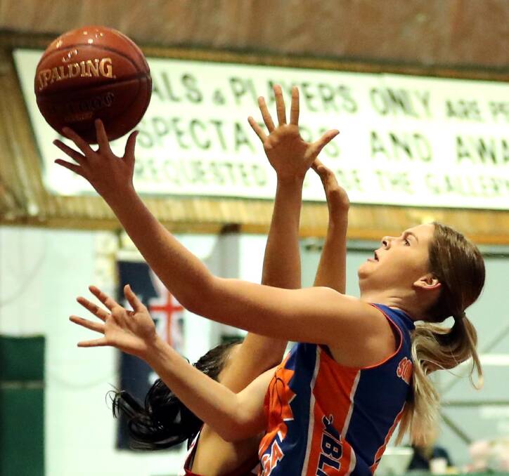 JUGGLING ACT: Jessica Summerfield tries to put up a shot despite from strong Coffs Harbour defence in Wagga Blaze's 58-50 loss at Bolton Park Stadium on Saturday. Picture: Les Smith