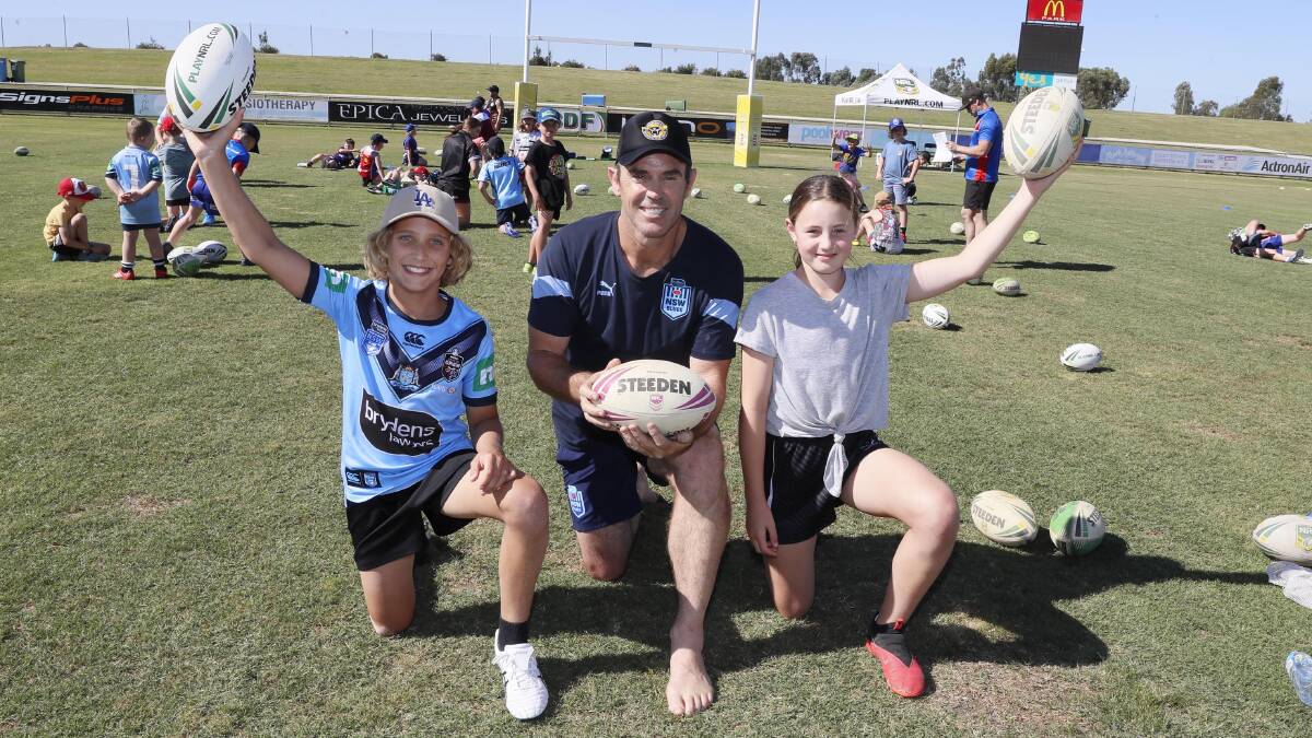 SPECIAL VISIT: Harry Rynehart, 11, and Evie Perry, 12, with NSW State Of Origin coach Brad Fittler
at a coaching clinic at Equex Centre on Saturday. Picture: Les Smith