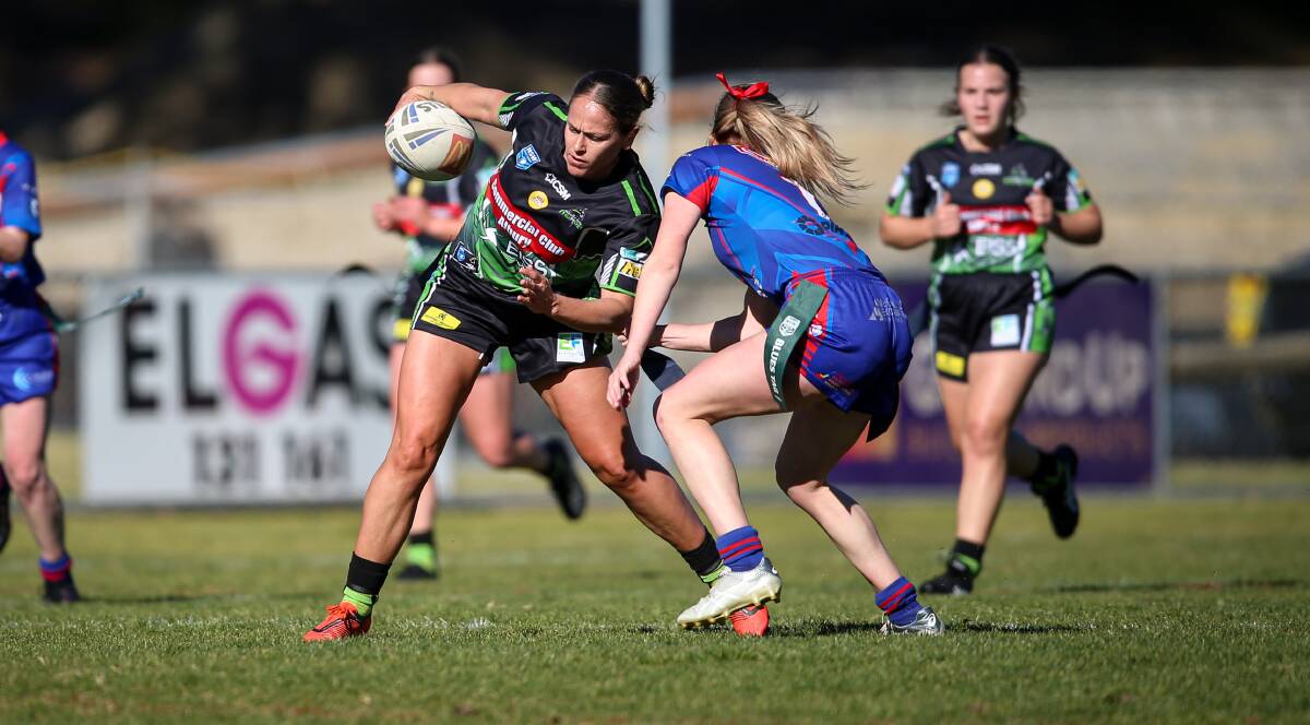 BREAKTHROUGH: Tash Clemson tries to avoid being tagged in Albury's win over Kangaroos at Greenfield Park on Sunday. Picture: James Wiltshire