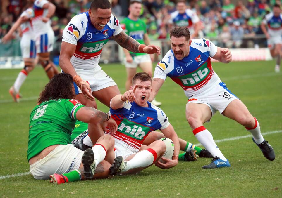 COMEBACK COMPLETE: Newcastle Knights celebrate as Jayden Brailey scores to secure a 24-16 win over Canberra Raiders at Equex Centre on Saturday. Picture: Les Smith