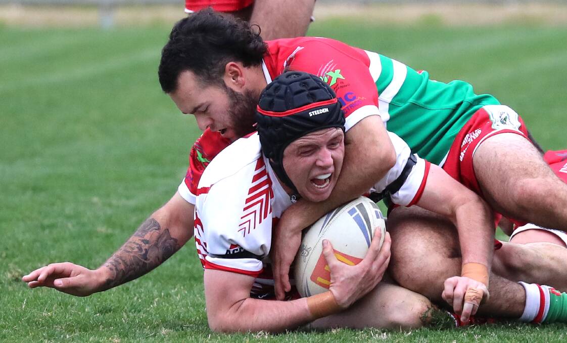 Temora coach Sam Elwin gets brought down by Tyson McLachlan last season. The Dragons won't take their place in any 2020 season.