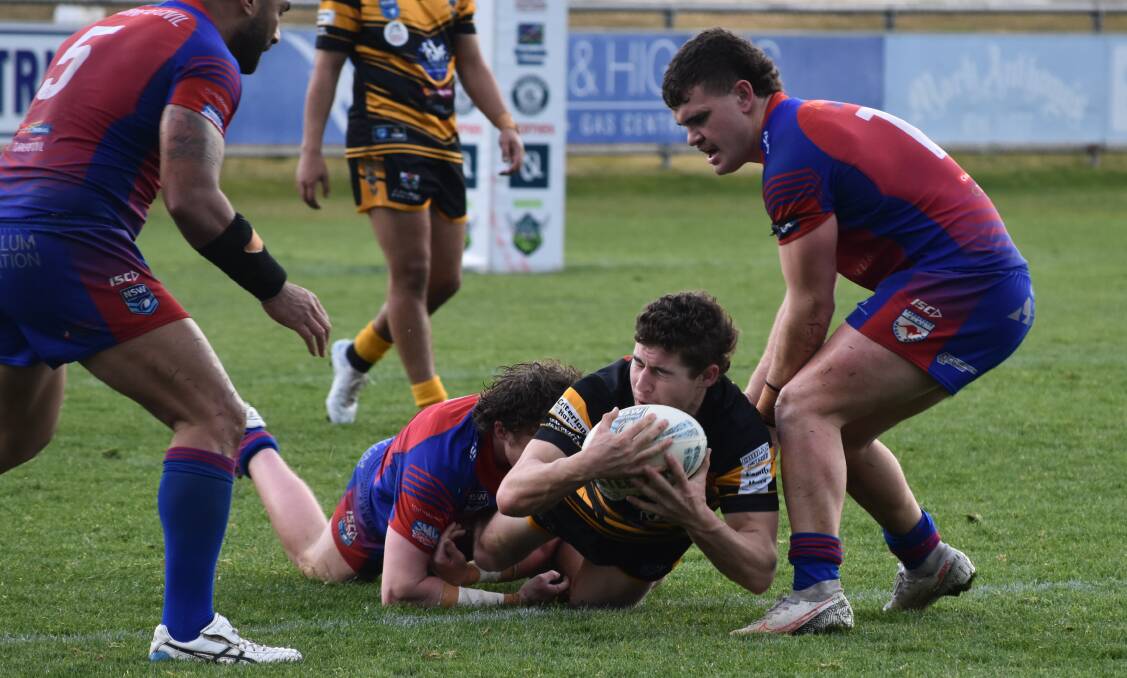 SLIPPERY STUFF: Jack Lloyd tries to collect the ball during Gundagai's win over Kangaroos on Saturday. Picture: Courtney Rees