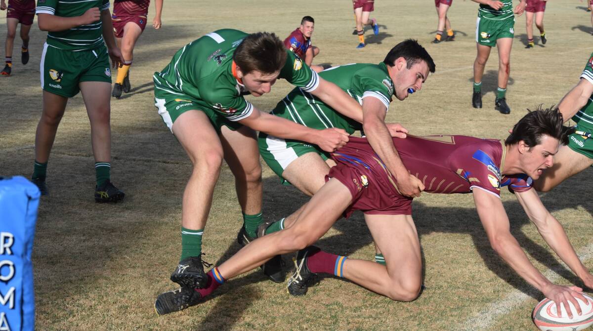 CLOSE CALL: Hamish Gilmore goes over for a decisive try as Mater Dei extended their unbeaten start to the Super Sixes competition on Thursday. Picture: Courtney Rees