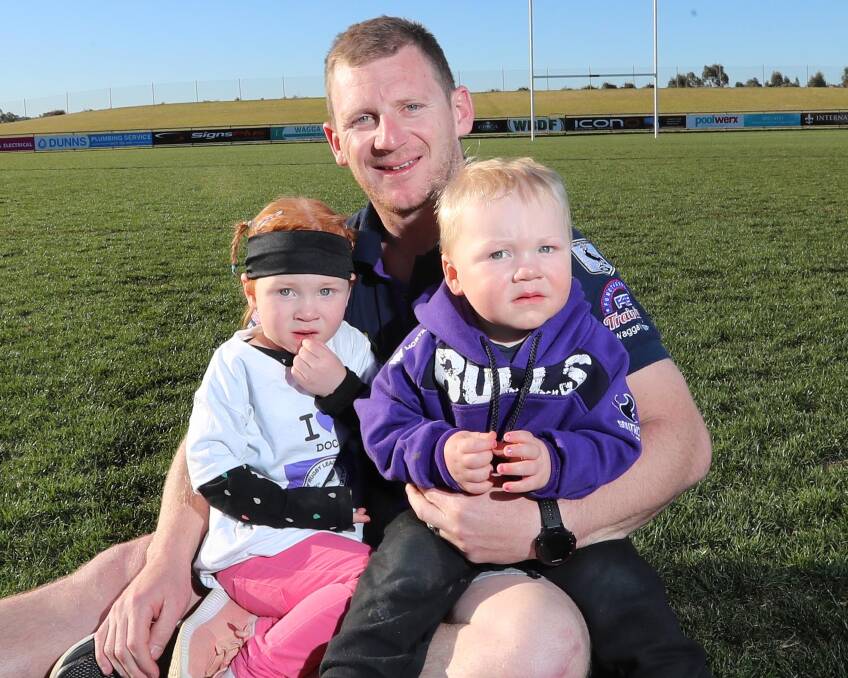 LEADING THE WAY: Southcity captain-coach Kyle McCarthy, with children Stella, 3, and Chet, 2, is looking to guide the Bulls to another premiership after missing last year's win through injury. Picture: Les Smith