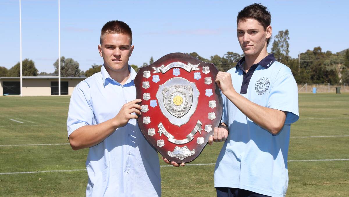 UP FOR GRABS: Kildare Catholic College captain Will McDermott and Mater Dei Catholic College counterpart Tom Ferguson are both looking to raise the Hardy Shield after Monday's final. Picture: Les Smith