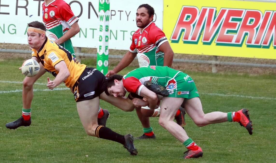 CREATIVE SPARK: Fullback Dane O'Hehir gets the ball away under pressure from Sam Macklan in Gundagai's win over Brothers at Equex Centre on Sunday. Pictures: Les Smith