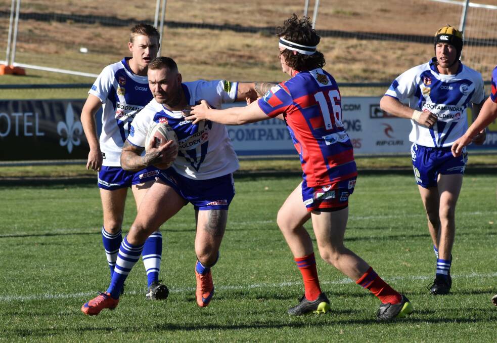 BIG EFFORT: Chris Maher, pictured trying to push off Kangaroos forward Nic Baker, scored four tries in Cootamundra's win on Saturday. Picture: Courtney Rees