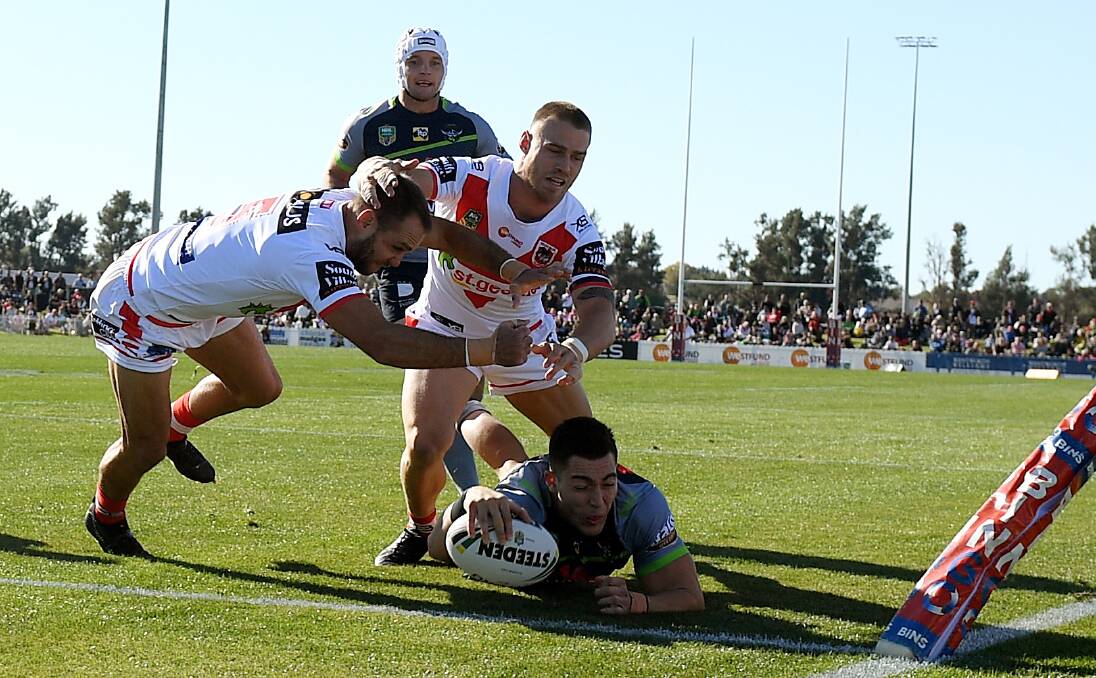 TRY TIME: Nick Cotric slamming the ball down for Canberra when they played at Mudgee earlier in the year. The Raiders are still looking to bring a NRL game to Wagga next season.