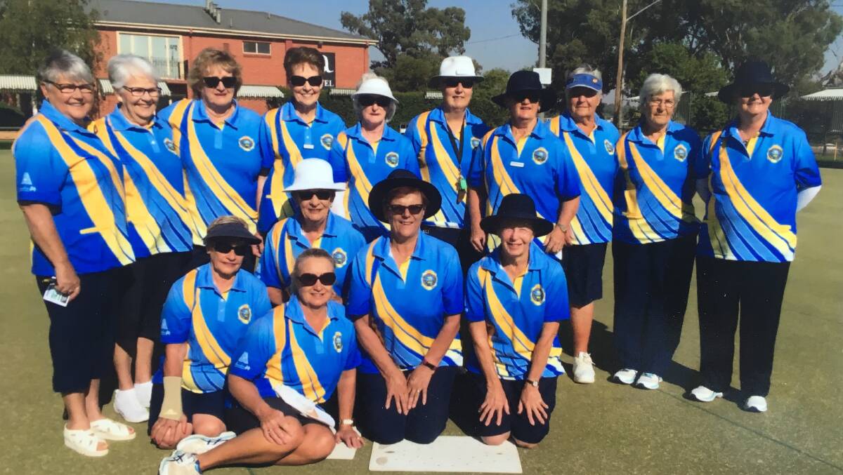 Members of the club showing off their new uniforms.