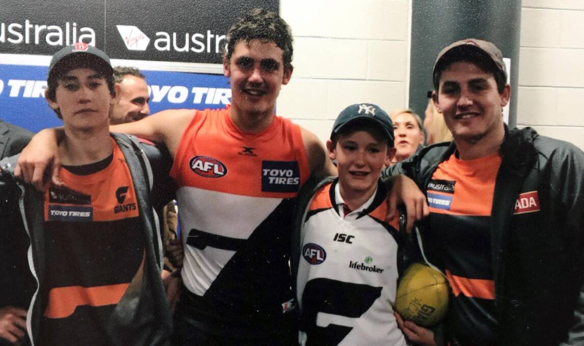 Ed, Harry, Joe and Nick Perryman, pictured after Harry's AFL debut for the Giants in 2017, will all play cricket together for Osborne on Saturday.