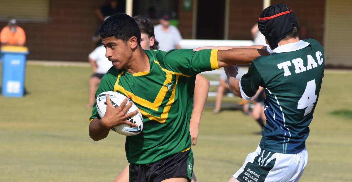 TOO STRONG: Jacob Iosefa pushes off Dylan Edwards as Mt Austin High and The Riverina Anglican College played out a draw. Picture: Courtney Rees