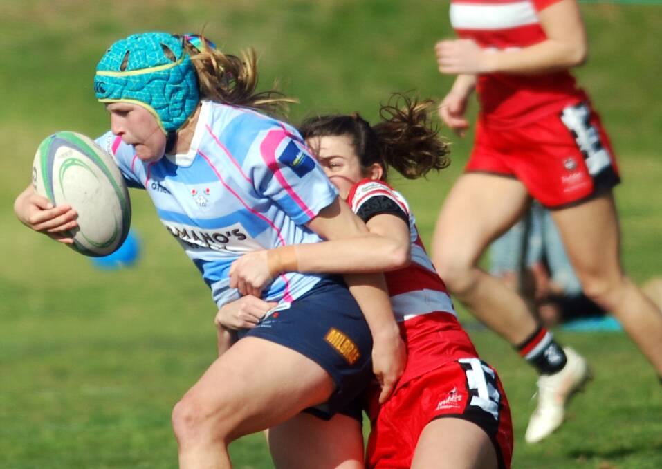 ALL SQUARE: Rhianna Burke is brought down by the CSU defence as Waratahs played out a draw at Conolly Rugby Complex on Saturday. Picture: Sean Cunningham