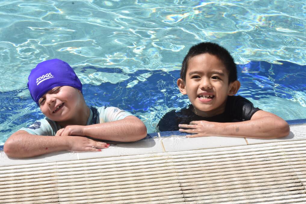 FUN IN THE SUN: Olivia Collins and Johann Go at the Ashmont Public swimming carnival on Tuesday. Picture: Courtney Rees
