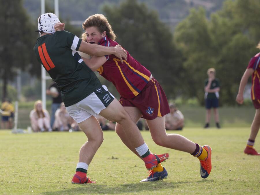 CONTACT: The Riverina Anglican College's Dylan Edwards tries to stop Mater Dei Catholic College's Lachlan Press in their Hardy Shield clash on Monday. Picture: Madeline Begley