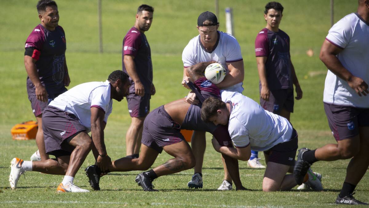 READY TO ROLL: Zac Masters and Royce Tout brings down Andrew Lavaka during Riverina's training run on Saturday. All three will tackle Macarthur Wests Tigers on Sunday. Picture: Madeline Begley