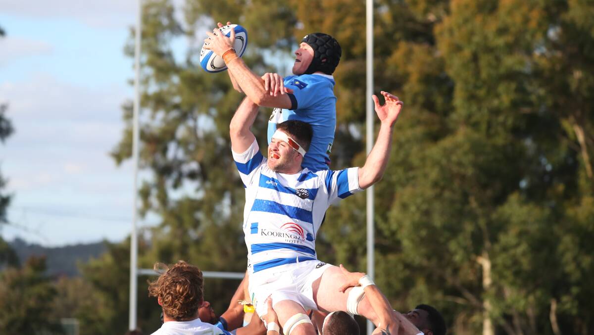 IN THE AIR: Joe Mullany goes up in a line up, beating Rory Sheard to the ball as Wagga City scored a 61-12 win over Waratahs on Saturday. Picture: Emma Hillier