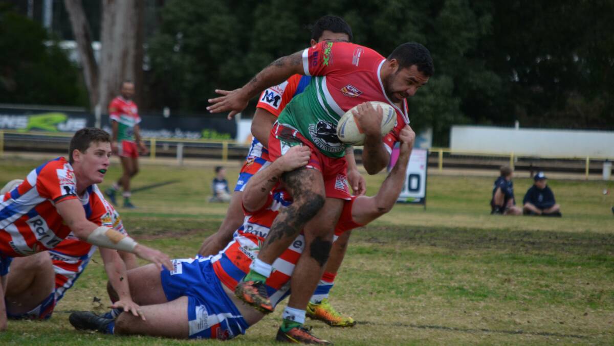 Ben Schreiber tries to bust out of a tackle as Brothers scored an important win over Young at Alfred Oval on Sunday.