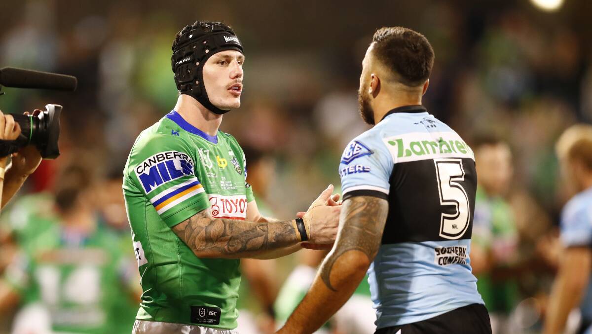 Young's James Schiller with Matt Ikuvalu after stopping him from scoring late in his NRL.