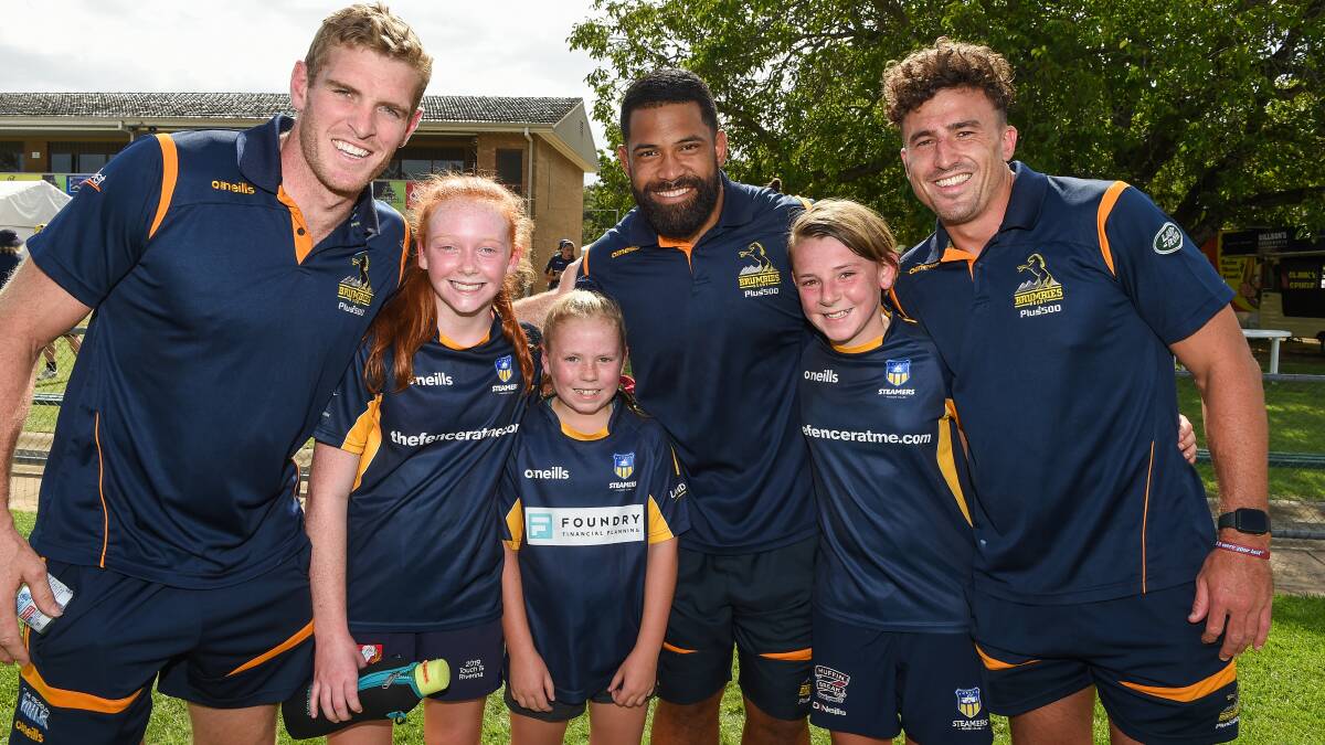 FAN MOMENT: Brumbies players Tom Cusack, Scott Sio and Tom Banks with Albury kids Liz Wantling, 14, Alice Bell, 10 and Rose Bell, 11 at Greenfield Park on Wednesday. Picture: Mark Jesser