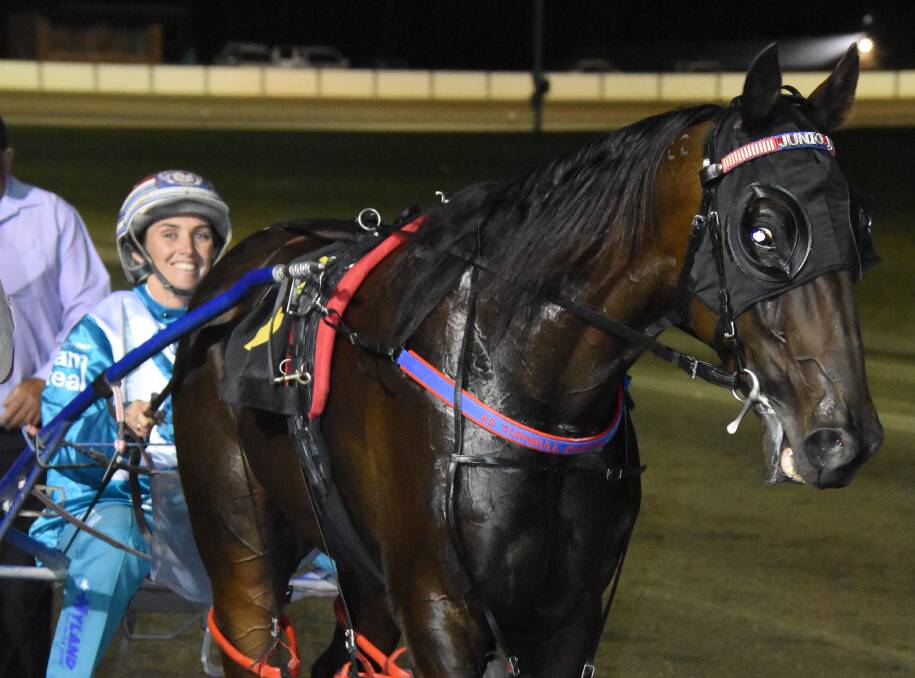 Amanda Turnbull celebrates after winning the Young Pacers Cup with Atomic Red on Friday night.