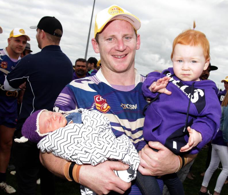 OH HOW YOU'VE GROWN: Kyle McCarthy with his young family after Southcity's premiership in 2016.