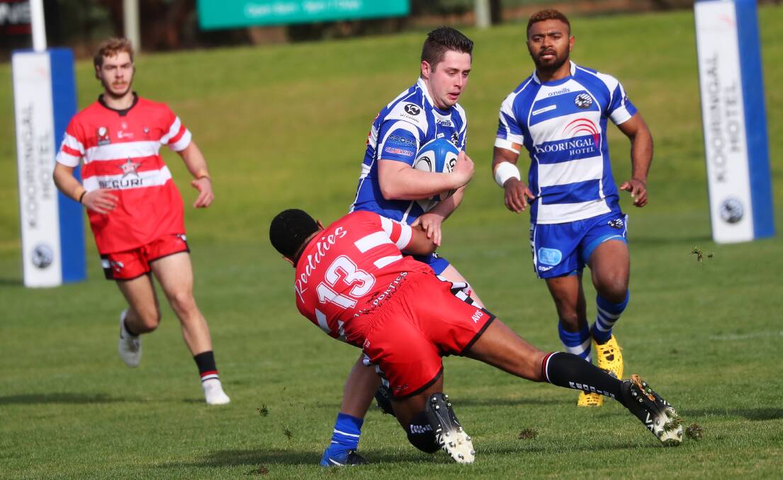 MISSING OUT: CSU centre Waisale Nayavulagilagi, pictured tackling Wagga City's Jesse Uhr in round one, will miss Saturday's rematch at Conolly Rugby Complex. Picture: Emma Hillier