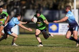 Jeremy Wiscombe tries to find a gap in between Lewis Arragon and Zac Masters in Albury's tight loss to Tumut at Greenfield Park on Sunday. Picture by James Wiltshire