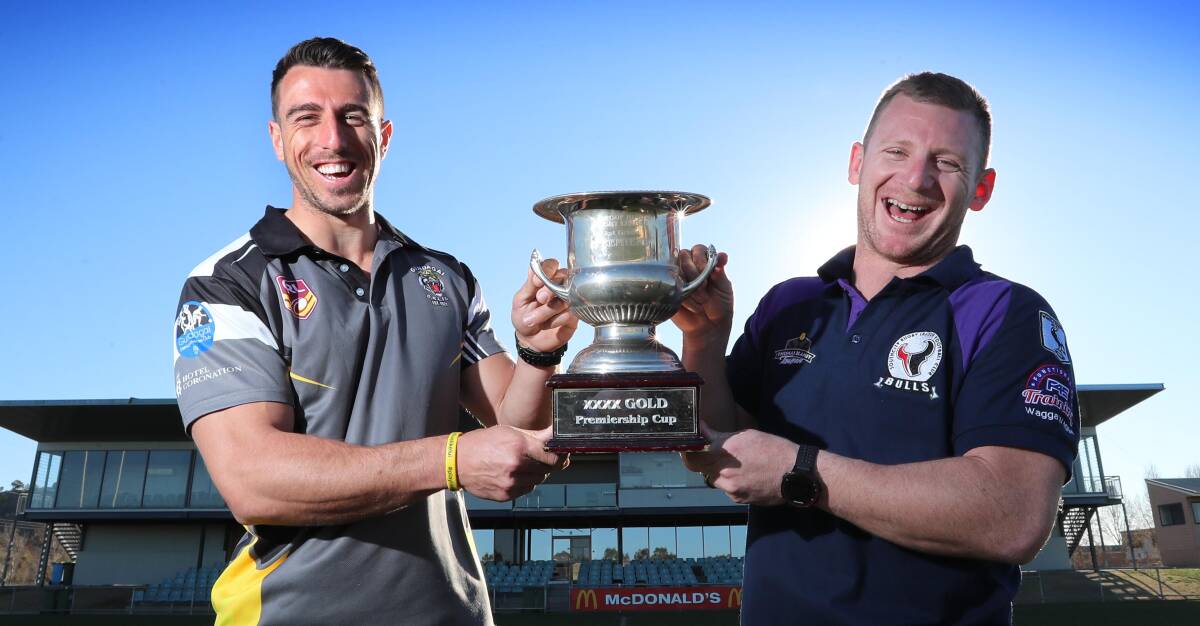 HERE WE GO AGAIN: Gundagai captain-coach James Smart and Southcity counterpart with what both teams will be playing for on Sunday. Picture: Les Smith