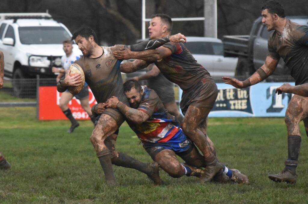 TOUGH GOING: Lachlan Bristow tries to break out of a tackle in Tumut's loss to Young on Saturday. Picture: Courtney Rees