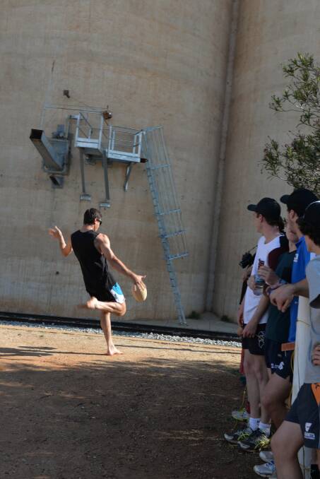 SILO KICK CHAMP: Mitch Haddrill of Ariah Park prepares to send his winning
punt over the silos at Mirrool on Saturday.