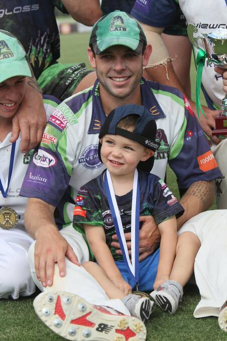 SPECIAL WIN: Jon Nicoll celebrates with son Cooper, 3, as Wagga City claimed a five-wicket win in the Wagga cricket grand final on Sunday. Picture: Laura Hardwick