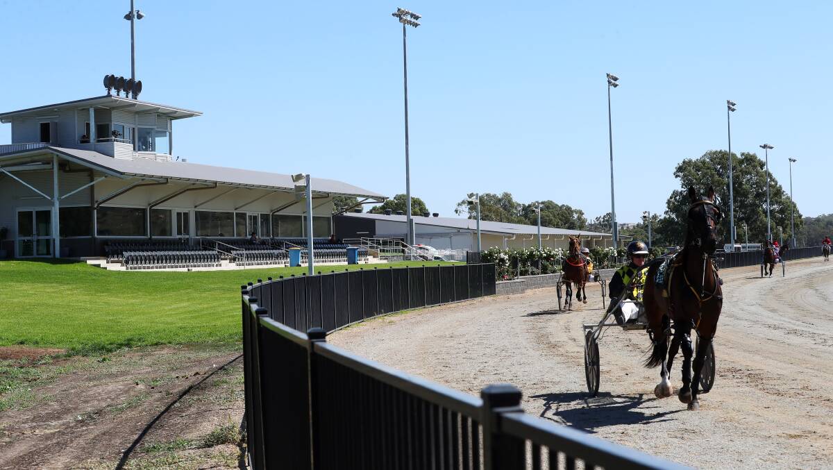 CLOSED OFF: Bruce Harpley warms up Susan Joy in front of an empty stand due to the restrictions caused by the coronavirus threat at Riverina Paceway on Friday.