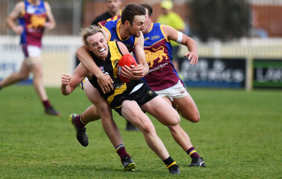Daniel Foley looks to tackle Brendan Myers as Wagga Tigers proved too strong at Robertson Oval on Saturday.