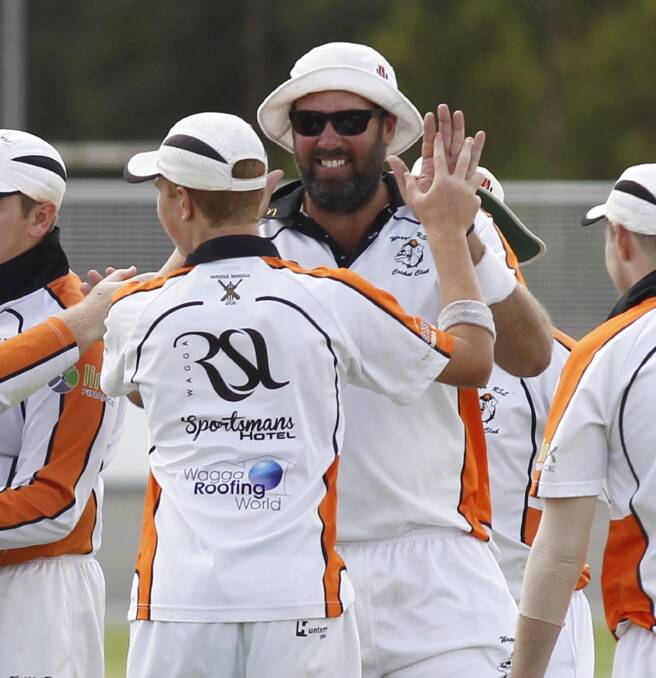 NEW LEADER: Neil Morton, pictured celebrating a wicket with teammates last season, will coach Wagga RSL for the 2017-18 cricket season. He's yet to name a captain. Picture: Les Smith