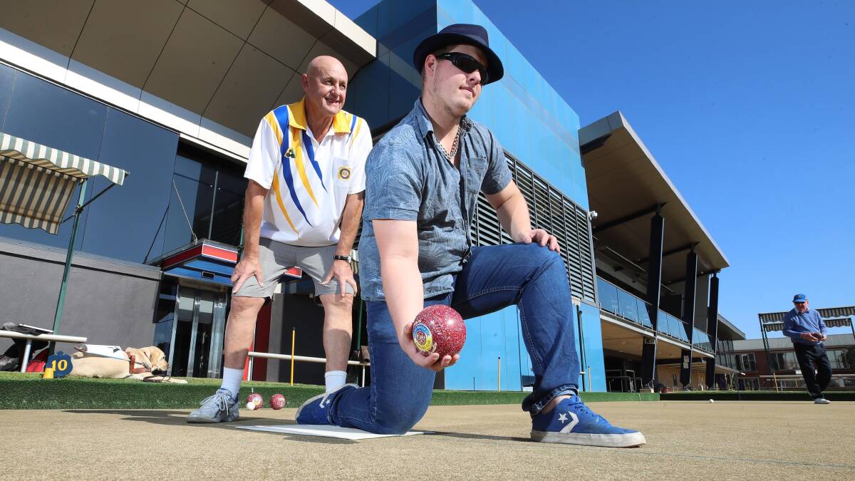 Joel Jensen practising his bowling at the Wagga RSL Club under the tutelage of Kevin Smith.