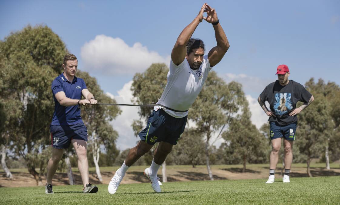 DIFFERENT FOCUS: Andrew Heffernan puts Canberra Raiders forward Sia Soliola through a speed and agility course as part of his new career. Picture: The Canberra Times