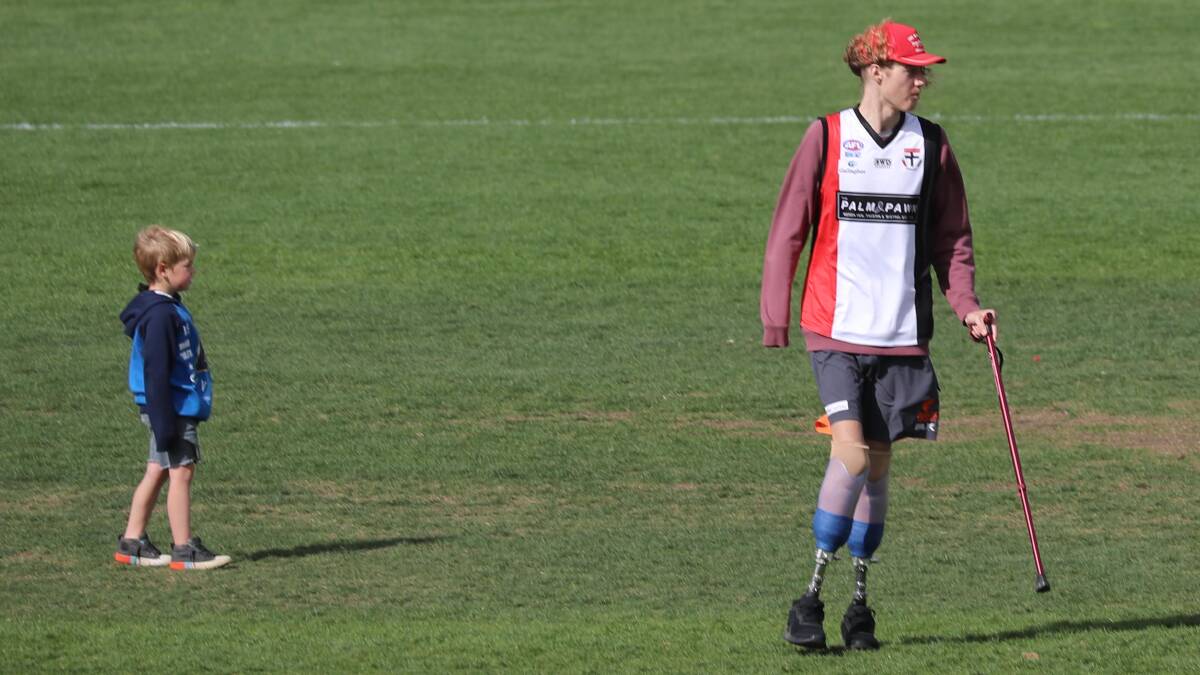 INSPIRATION: Josh Hanlon tosses the coin in the 2018 Farrer League grand final months after needing to have both legs and a hand amputated.