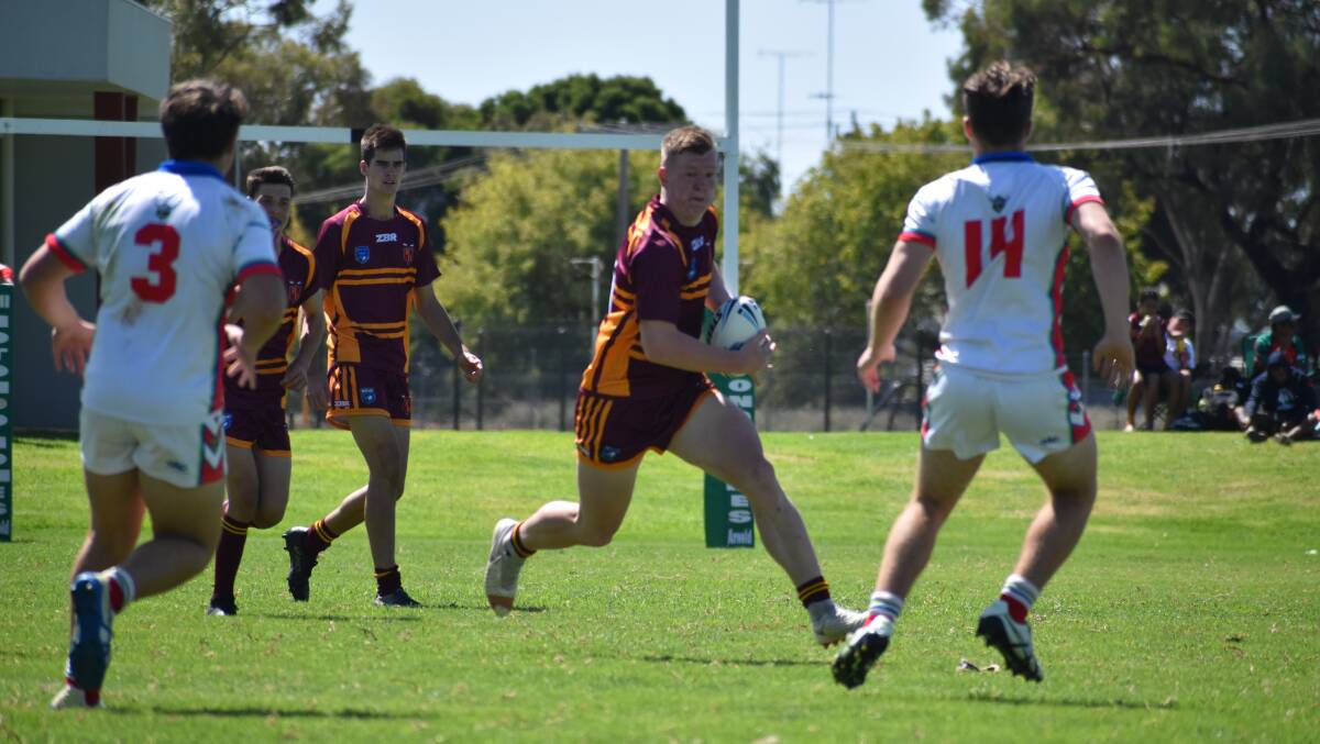 ON THE WAY: Nick Jenkin tries to slice through the Monaro defence in Riverina's big win to finish their Laurie Daley Cup campaign at Leeton No.1 Oval on Sunday. Picture: Liam Warren