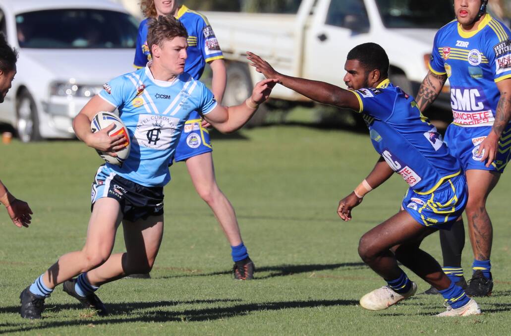 NEW ROLE: Brayden Draber tries to push off Rusiate Kaliseiwaqa during a strong performance after moving to fullback for Tumut in their win over Junee on Sunday. Picture: Les Smith