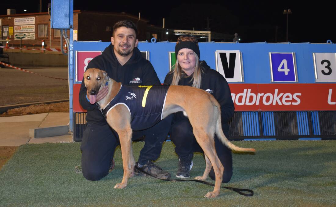 SWEET SUCCESS: Clint Colaiacovo and partner Jess Fothergill celebrate the victory of Run Fast Maximus at Wagga on Friday night. It was a winning debut for the Wagga trainer after four unplaced efforts in Victoria. Picture: Courtney Rees