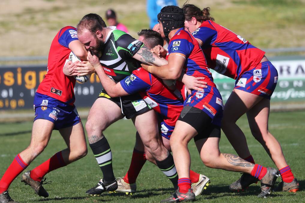 MOB EFFORT: Kangaroos come in big numbers to try and stop Brad Nicholson in their big win over Albury at Equex Centre on Saturday. Picture: Emma Hillier
