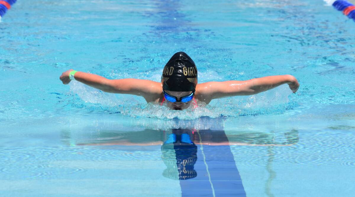 OFF AND FLYING: Reegan Edwards glides down the pool on her way to a big win in the individal medley at North Wagga Public's carnival on Monday. Picture: Courtney Rees
